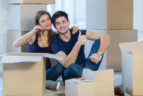 Removal team planning a home move in Chelsea street with packing boxes