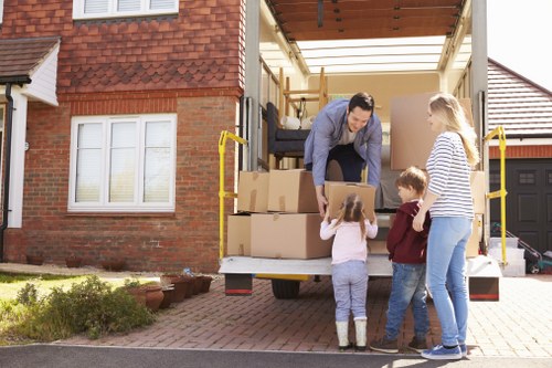 Professional Chelsea movers preparing boxes and furniture for a local relocation