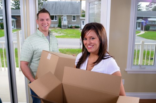 Removal crew handling a same day move in Chelsea street setting