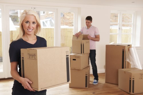 Removal team planning a house move in Chelsea with packed boxes and furniture