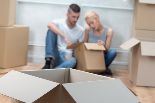 Packed moving boxes and furniture ready for transport in Chelsea