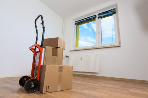 Professional movers handling stairs and access challenges in a Chelsea property
