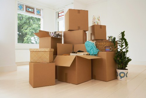 Moving furniture down stairs in a Chelsea flat with narrow access