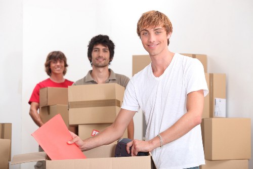 Packed boxes and furniture ready for urgent removals in Chelsea