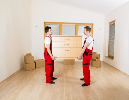 Careful packing and loading of boxes for a Chelsea apartment relocation